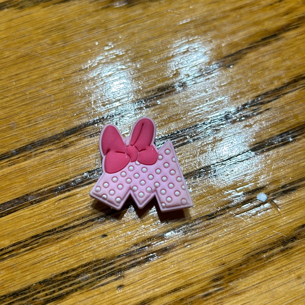 Jibbitz Minnie Mouse CROCS decorations.  Pink “M” with pink bow.  Good condition